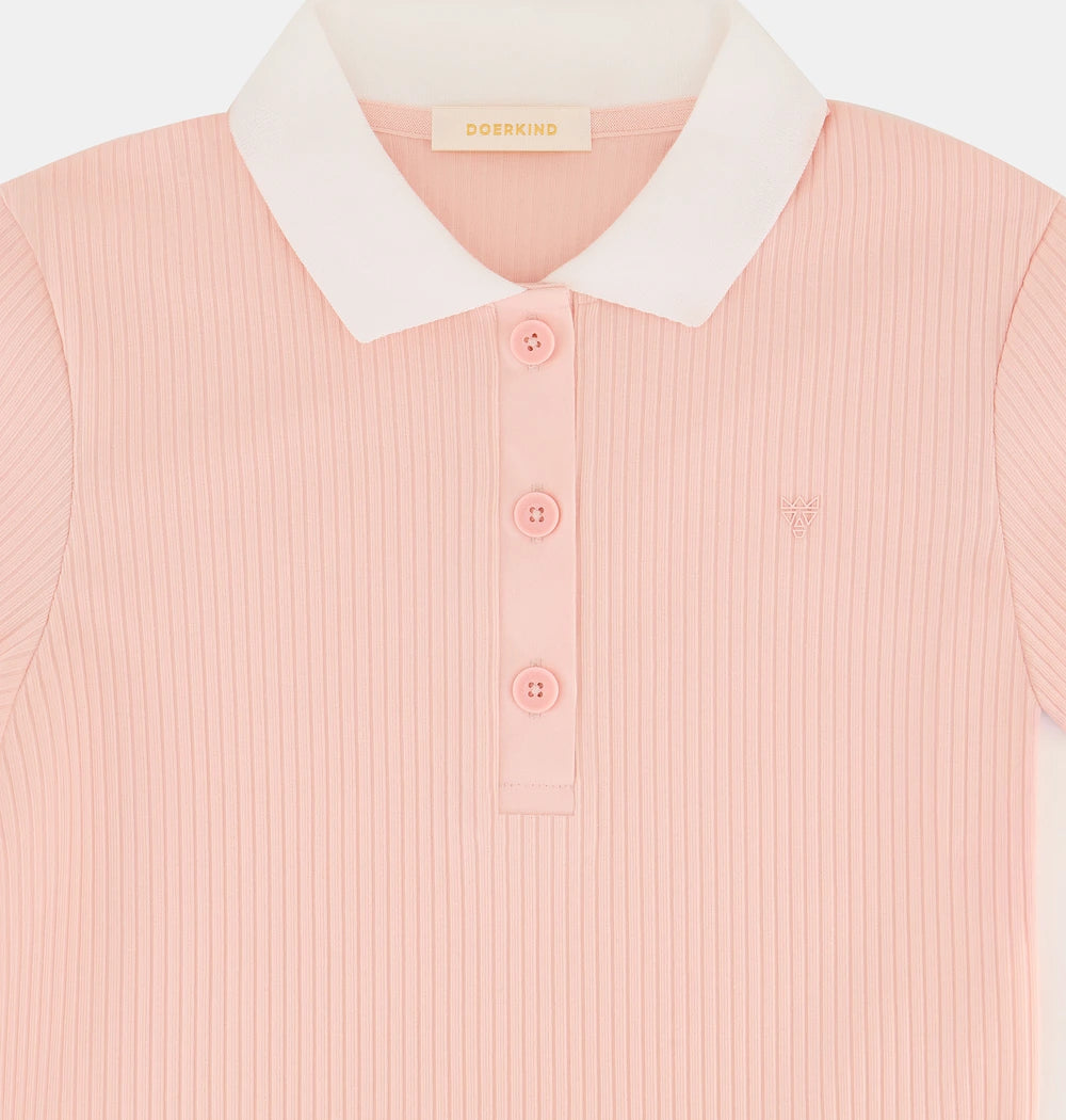 A long-sleeved pink doerkind polo shirt with white collar and trim, buttoned front, and ribbed texture.